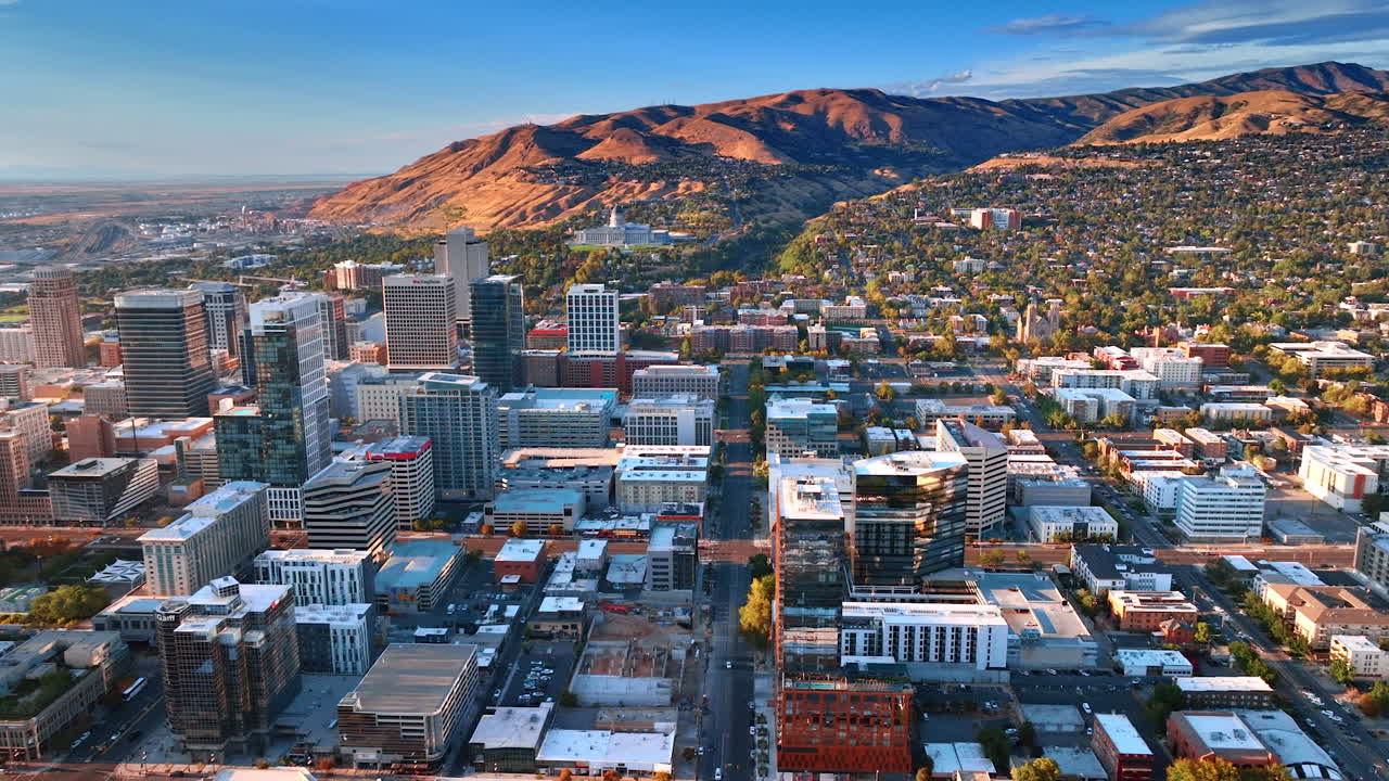 Salt Lake Sity USA, 14 August 2025: Salt Lake City downtown scenery from drone. Green residential area scattered on the mountain slopes