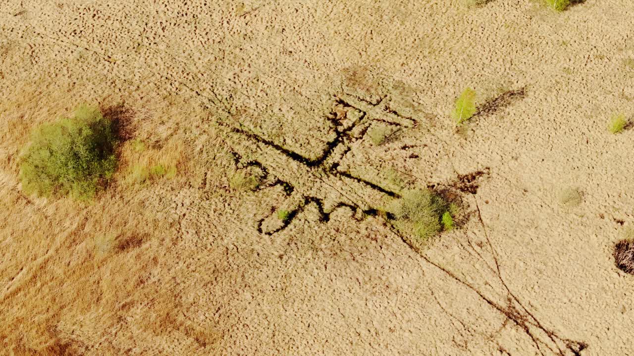 Aerial view of WWII-era fake plane trenches used to mislead bombers in Latvia