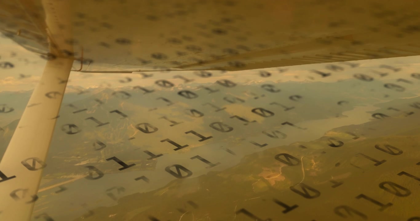 Binary code fading over wing strut window, plane gliding to demonstrate live data streaming