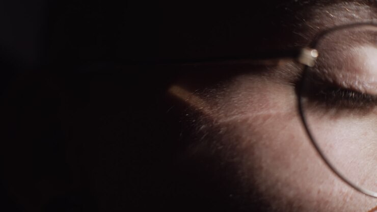 Close-up of a person wearing glasses