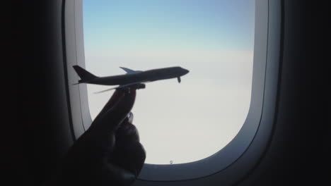 woman with plane model against illuminator