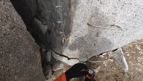 pov of climber clipping into a cable with their carabiner