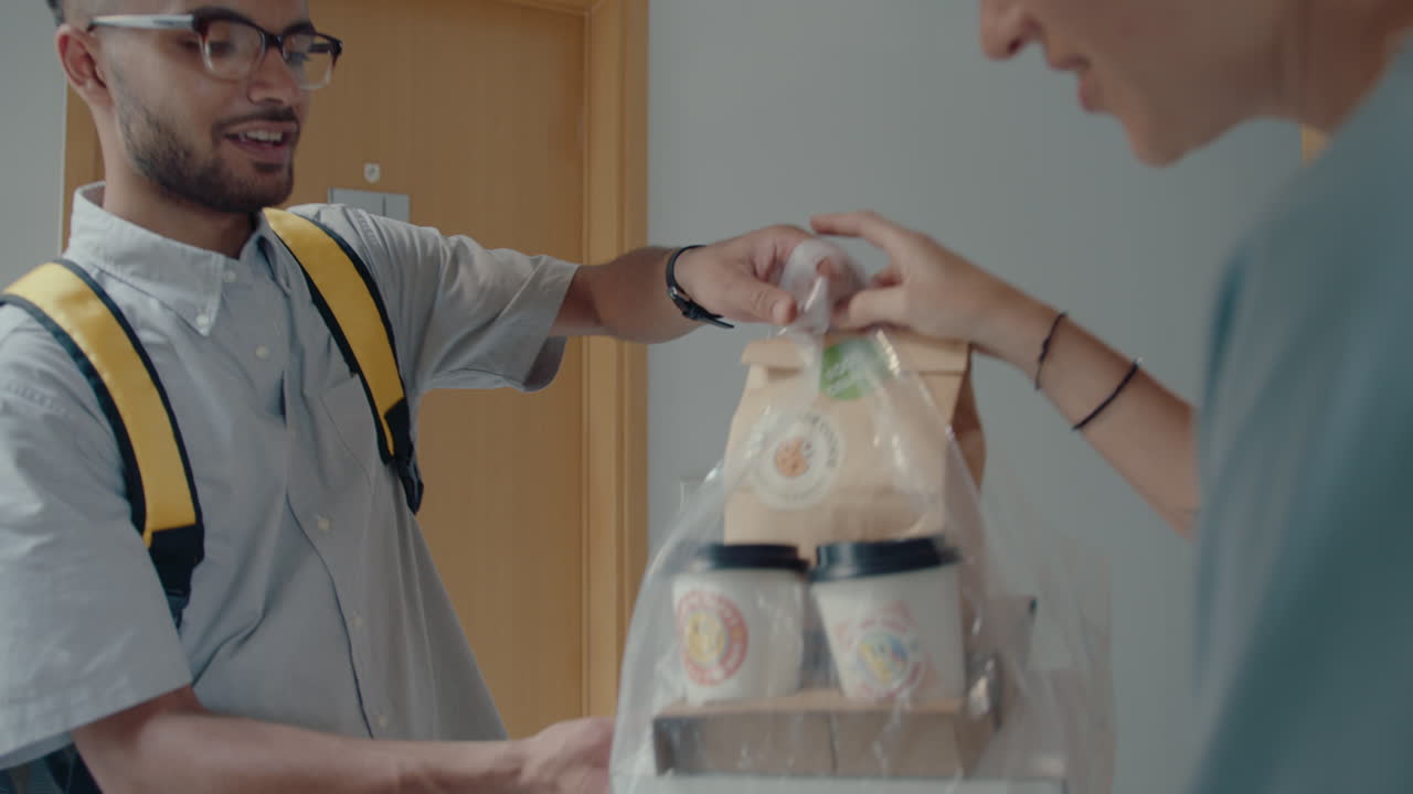 Woman Receiving Food Order from Delivery Guy