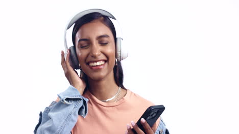 Woman,-headphones-and-phone-in-studio