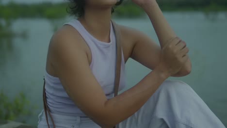 A-close-up-shot-captures-the-serenity-of-an-Indian-young-teenage-girl-sitting-by-the-sea