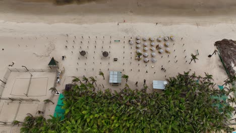 empty beach volleyball courts and lounge chairs at a seaside resort in fortaleza, brazil