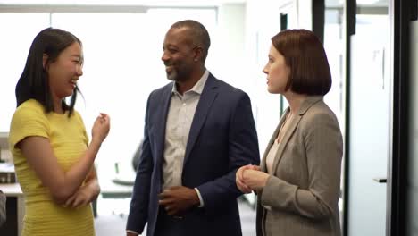 engaging workplace conversations: a group of professionals sharing ideas and laughter in an office setting