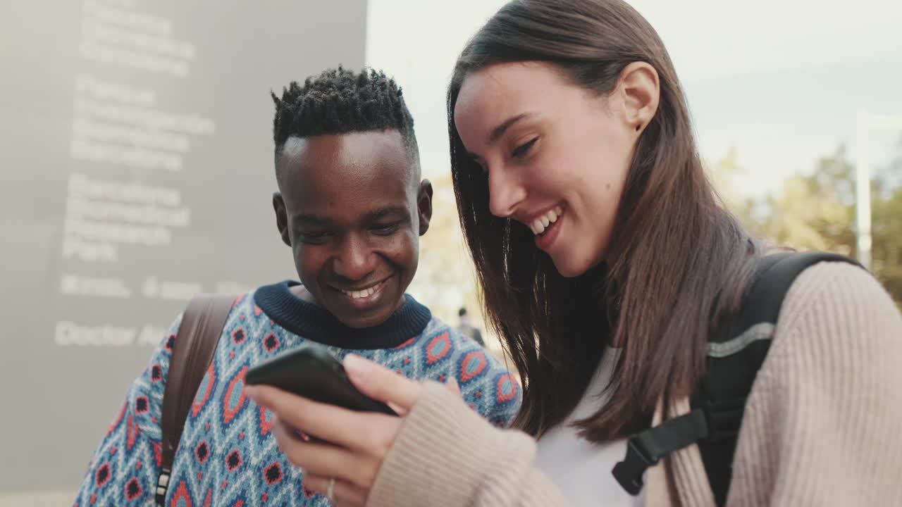 Friends looking at a smartphone