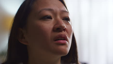 close up of stressed or anxious woman suffering with depression anxiety or loneliness sitting in room at home 5