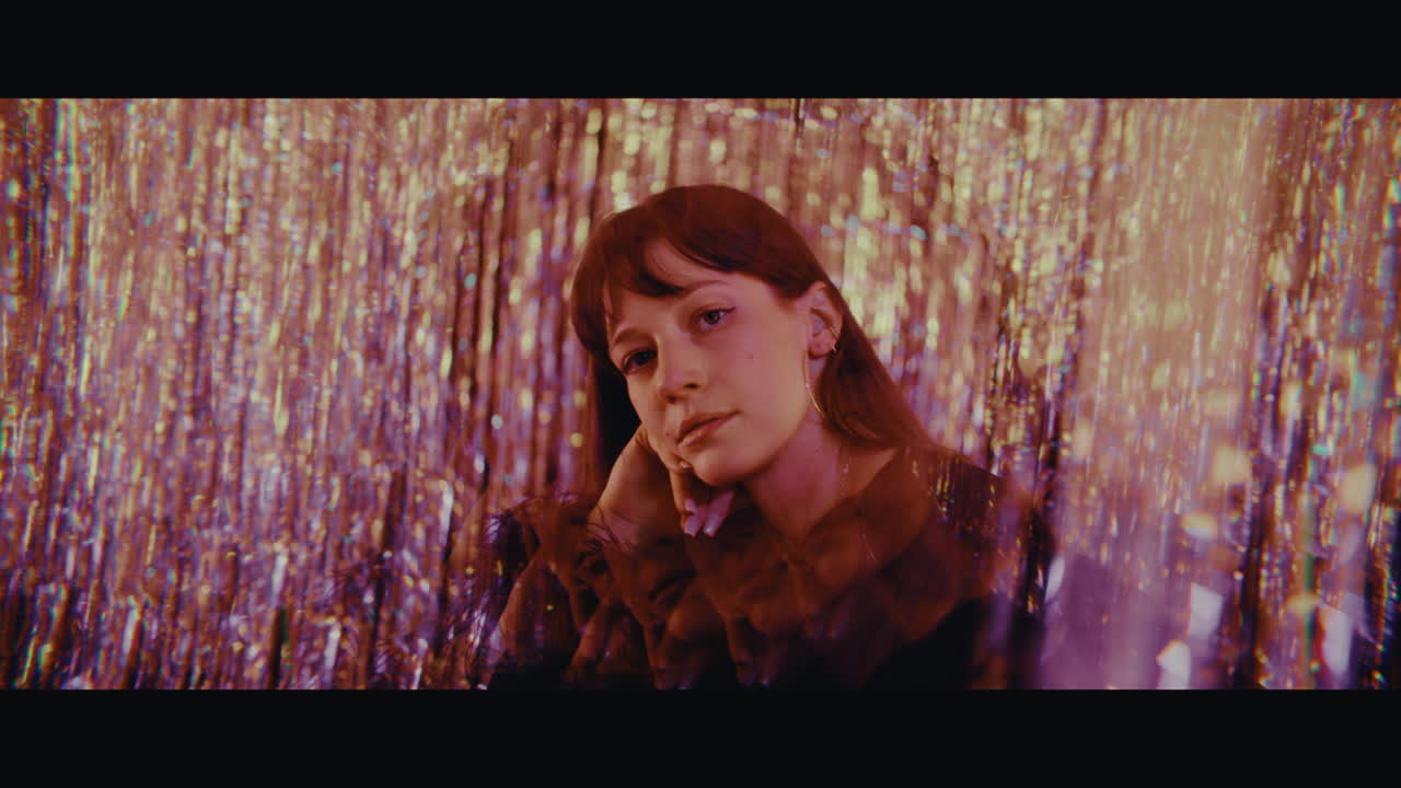 Woman in a purple glitter backdrop