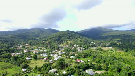 township of bailif in jungle and mountains of guadeloupe, aerial view