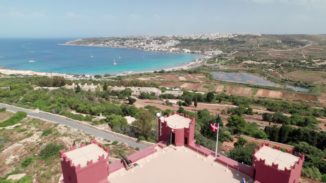 Flying over the Red Tower in Malta. Popular landmark on Mediterranean Island