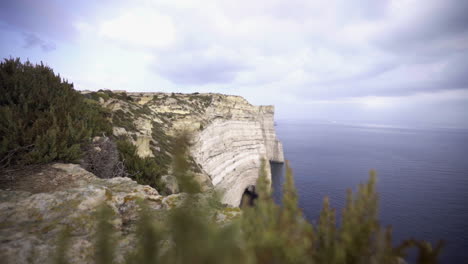 huge cliffs of sanap at gozo island on cloudy day