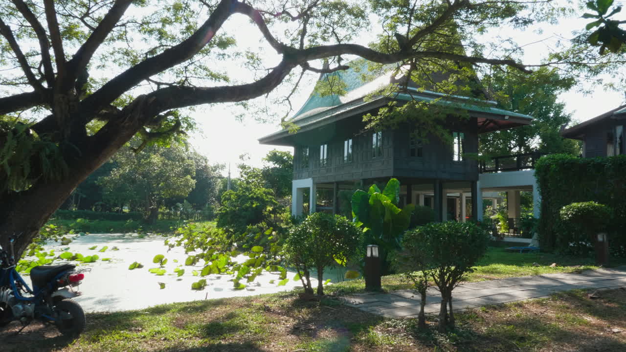 Tranquil Asian House by a Pond