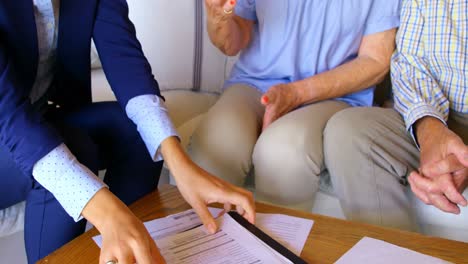 mid section of real estate agent shaking hands with senior woman at comfortable home 4k