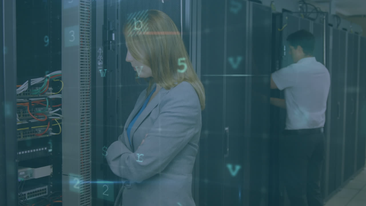 Man and woman checking computers in server room and security warning messages