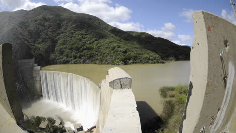 wide time lapse dolly shot from above matilija creek spilling over an obsolete matilija dam 2