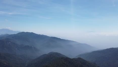 panning shot hazy neighboring valleys near mt baldy in southern california