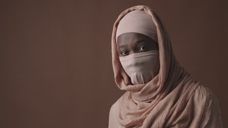 woman in hijab and mask