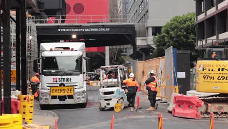 workers and machinery at a city construction site