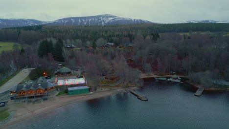 panning around boatshed restaurant on the banks of loch inshsurrounded by trees