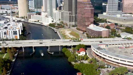 downtown city traffic and buildings of tampa bay, florida - aerial reveal