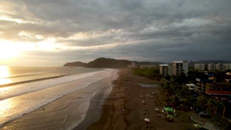 Jaco-Beach-Costa-Rica-at-Sunset-with-waves-and-beach-hotels