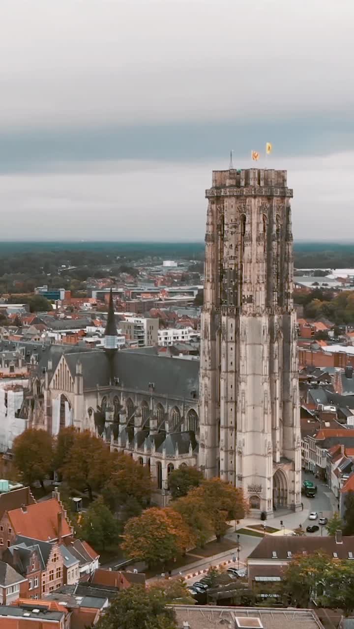 Mechelen’s saint rumbold’s cathedral on a cloudy autumn day, aerial view