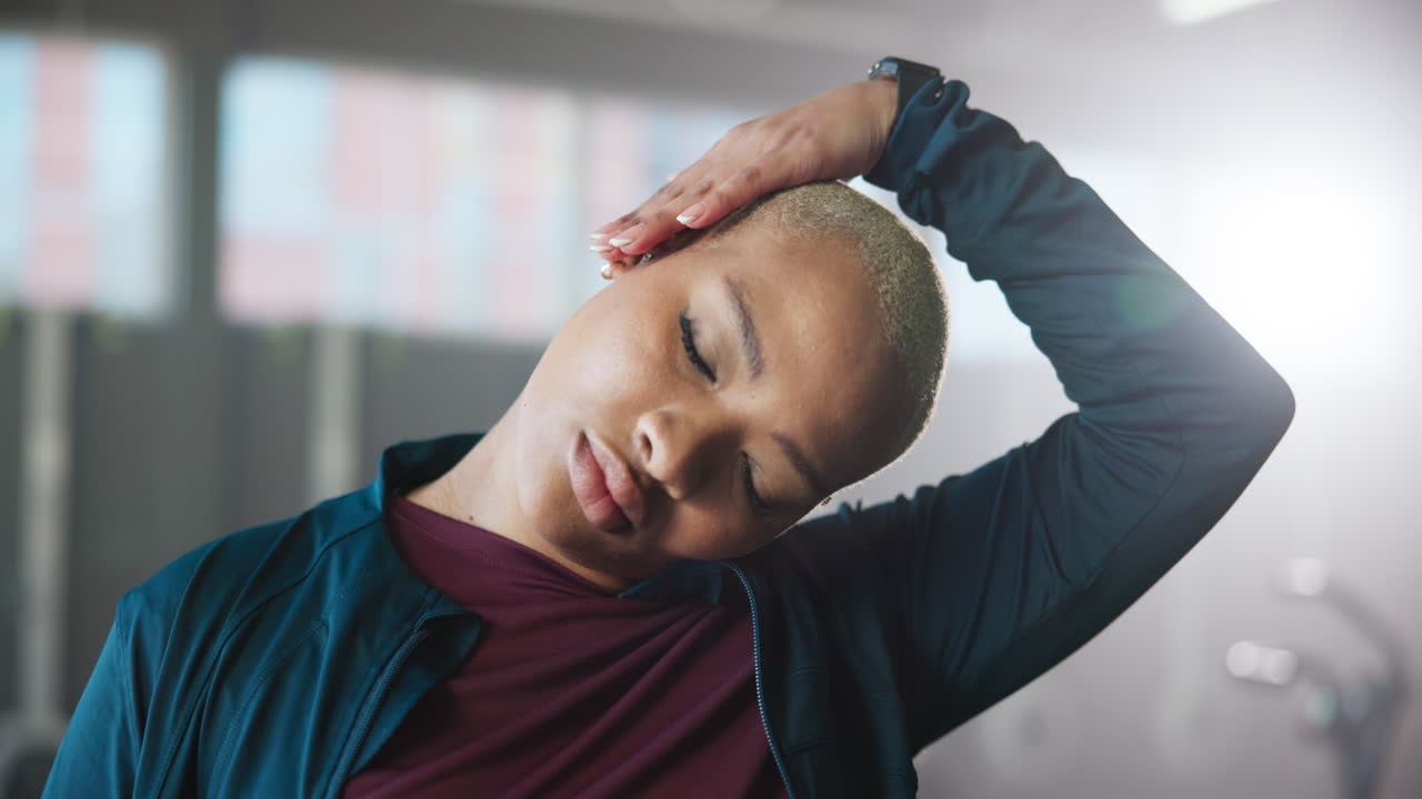Woman stretching her neck indoors