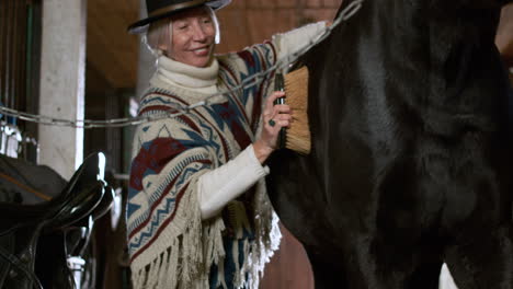 Person-taking-care-of-animal-indoors-closeup