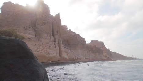 panning reveal of cliffs by the sea