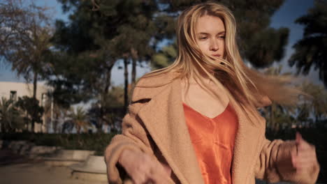 young woman walking outdoors.