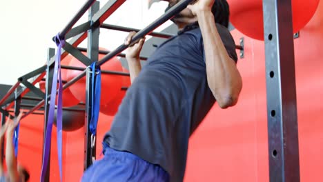 Athlete doing pull ups in the gym 4k