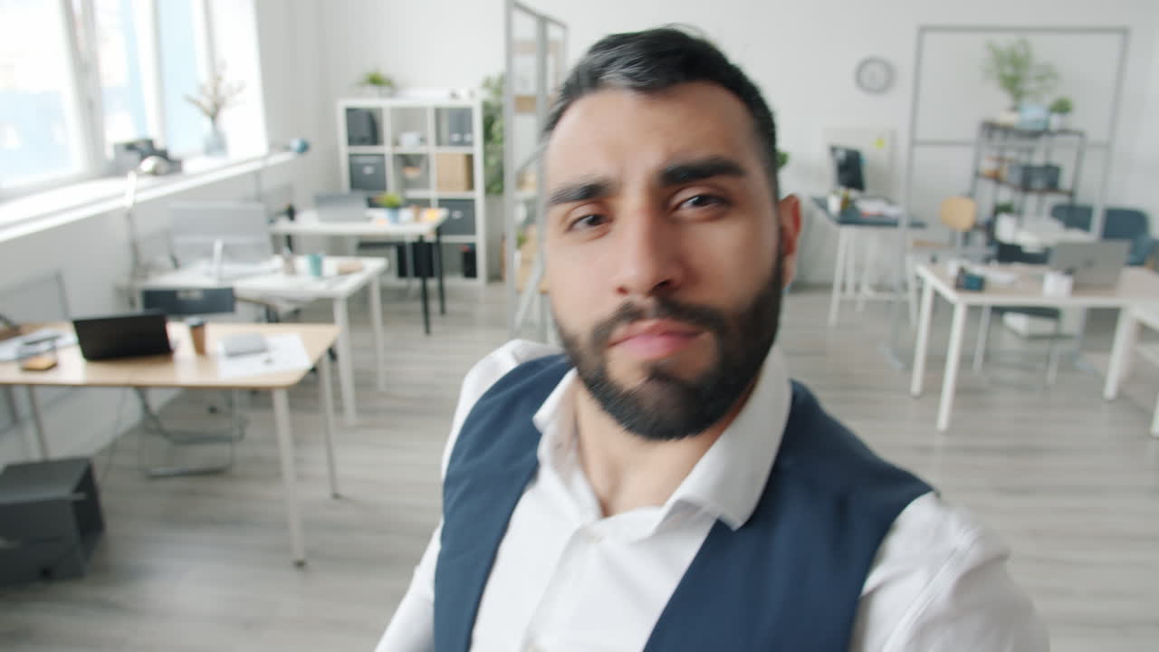 Man making funny faces in office