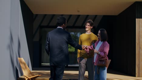 real estate agent meets with clients