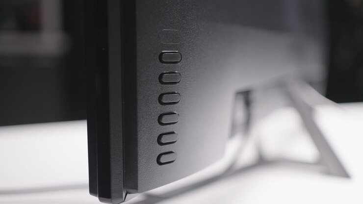 Close-up of a computer monitor's back panel with controls