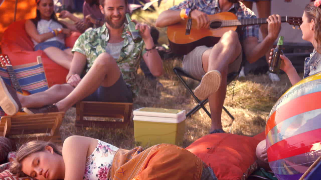 In high quality format pretty hipster relaxing on campsite 