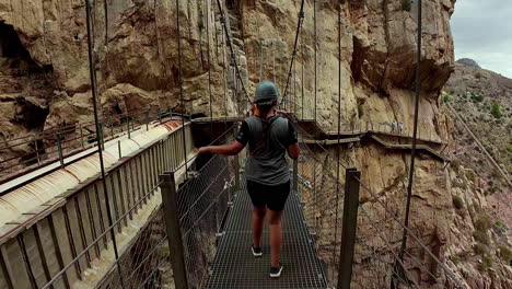 Woman-walking-along-the-Caminito-del-Ray-walkway-in-Spain