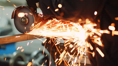 industry worker grinding metal with angle grinder 5