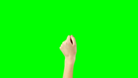 persona haciendo un gesto de la mano contra el fondo de la pantalla verde