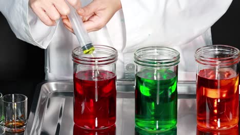 mixing colored liquids with a syringe