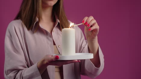 woman lighting a candle