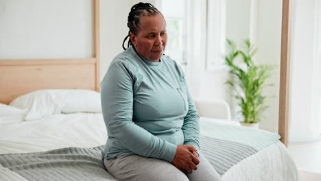 Senior-African-woman,-sad-and-bedroom