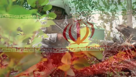 digital composition of waving iran flag against soldier with a gun keeping an eye on surroundings