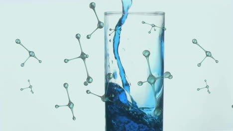 pouring blue liquid into glass with molecular structure animation in background