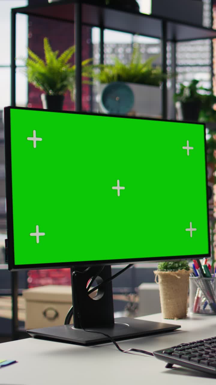 Vertical video Call center worker solving customers issues using green screen PC