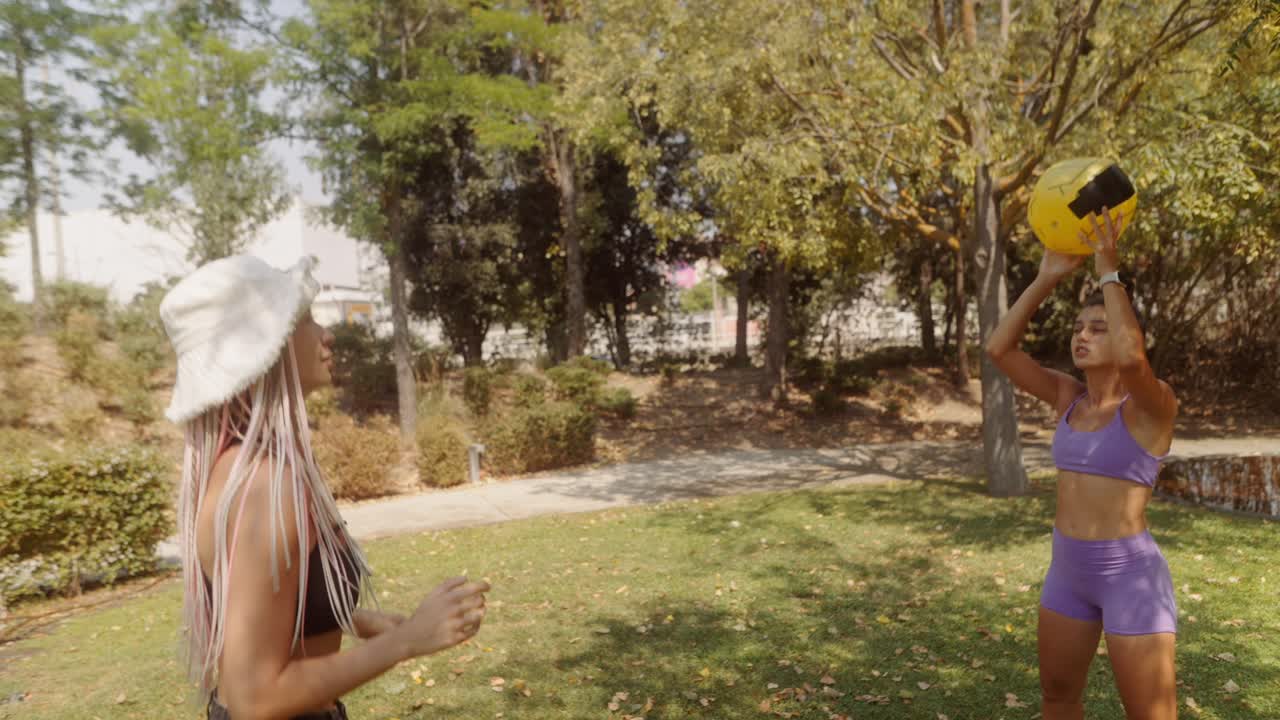 Women playing volleyball in the park