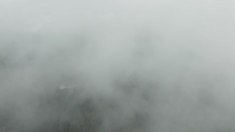 fast drone shot of paricutin volcano going into the clouds