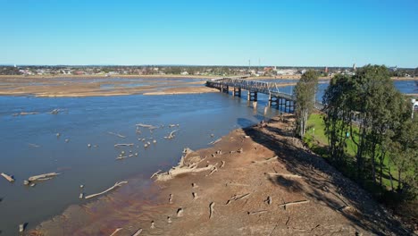 rising up over the dry lake bed with the road bridge and yarrawonga town in the background