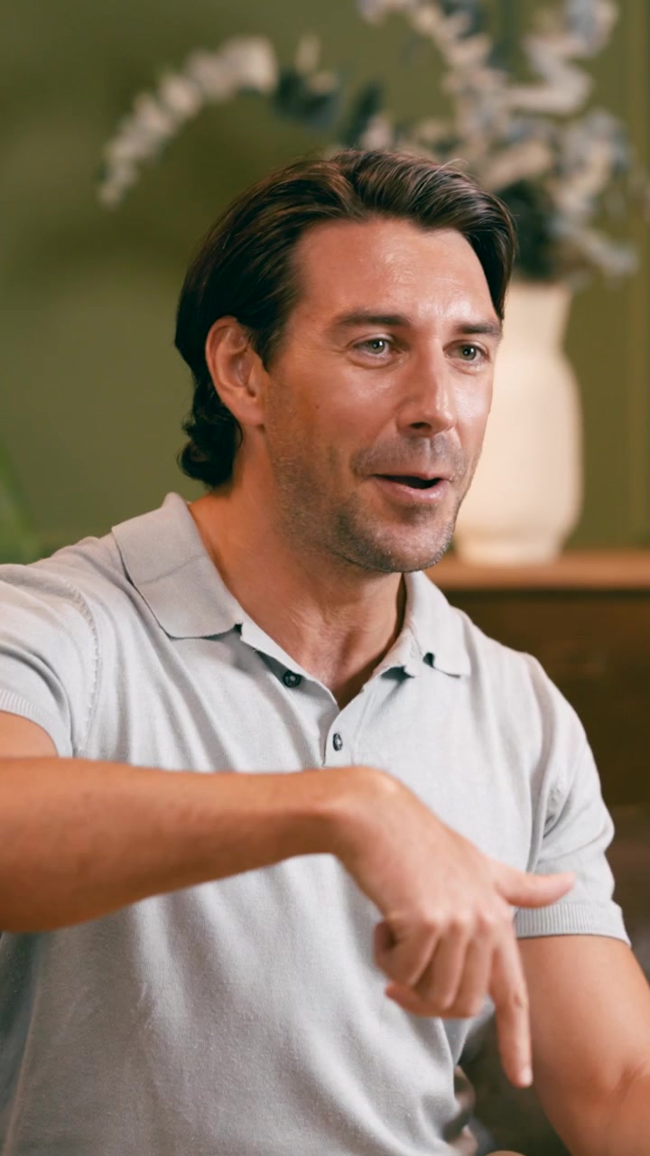 Man Talking and Gesturing During an Interview